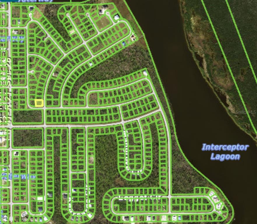This map shows a residential subdivision layout with a highlighted lot near Interceptor Lagoon — 10400 HATCHETT CIRCLE, PORT CHARLOTTE, FL