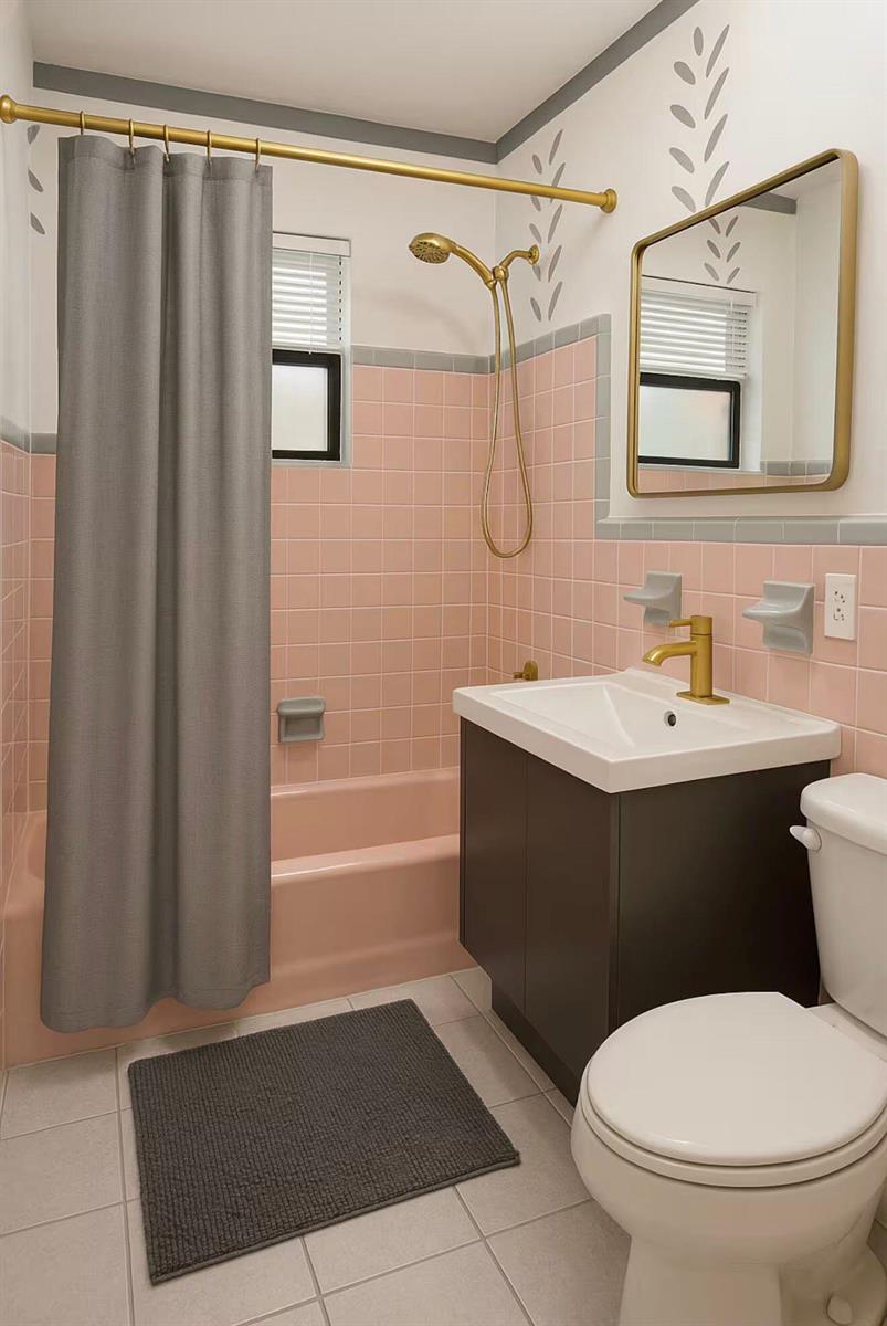 A bathroom features pink tiled walls, a dark vanity, gold fixtures, and a gray shower curtain — 272 NE 44th Street, Deerfield Beach FL 33064, DEERFIELD BEACH, FL