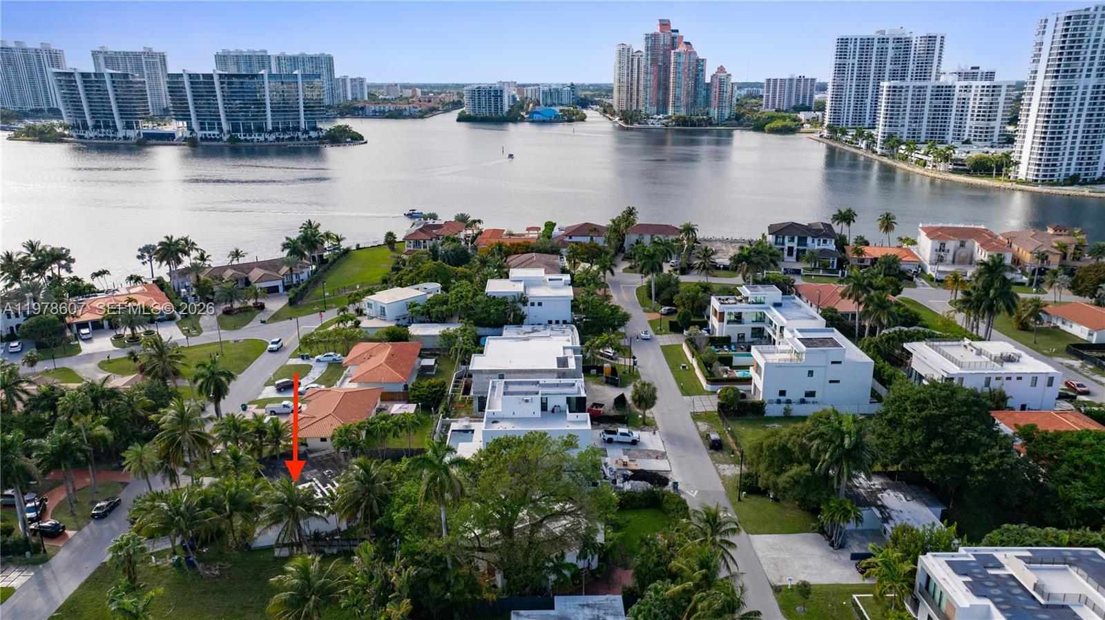 An aerial view shows a residential neighborhood with a red arrow pointing to a house — 331 188th St, Sunny Isles Beach FL 33160, SUNNY ISLES BEACH, FL
