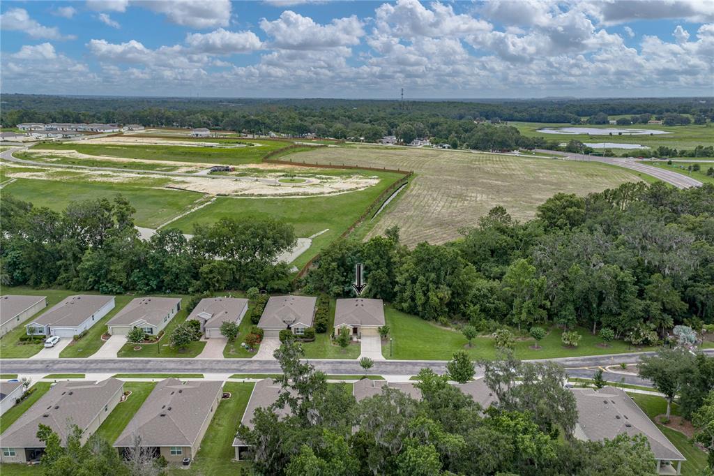 An aerial view shows a suburban neighborhood with a house marked by an arrow — 12322 EASTPOINTE DRIVE, DADE CITY, FL