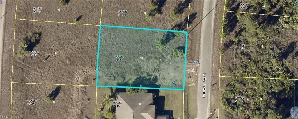 This aerial map shows a highlighted rectangular vacant lot adjacent to a paved road — 728 GODWID AVENUE S, LEHIGH ACRES, FL