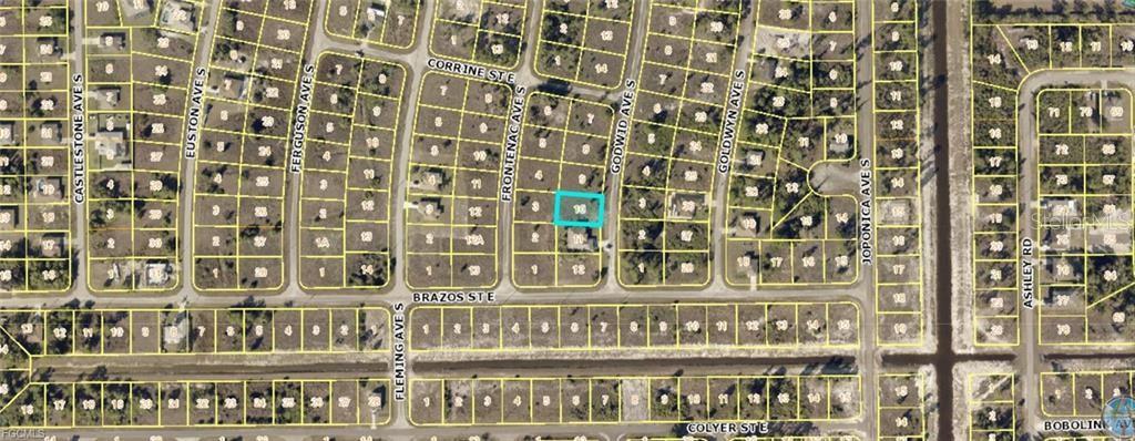 This is an aerial map showing a highlighted vacant lot in a residential neighborhood — 728 GODWID AVENUE S, LEHIGH ACRES, FL
