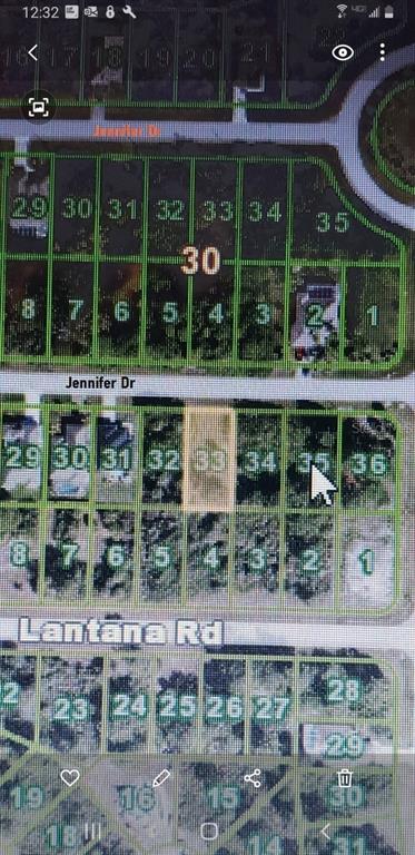 This is a map showing a highlighted vacant residential lot among several neighboring properties — 223 JENNIFER DRIVE, ROTONDA WEST, FL