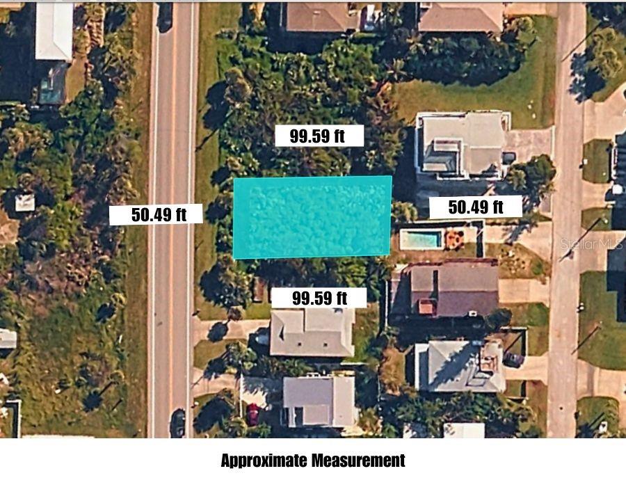 An aerial view showing a rectangular plot of land with its approximate dimensions labeled — TURTLEMOUND ROAD, NEW SMYRNA BEACH, FL
