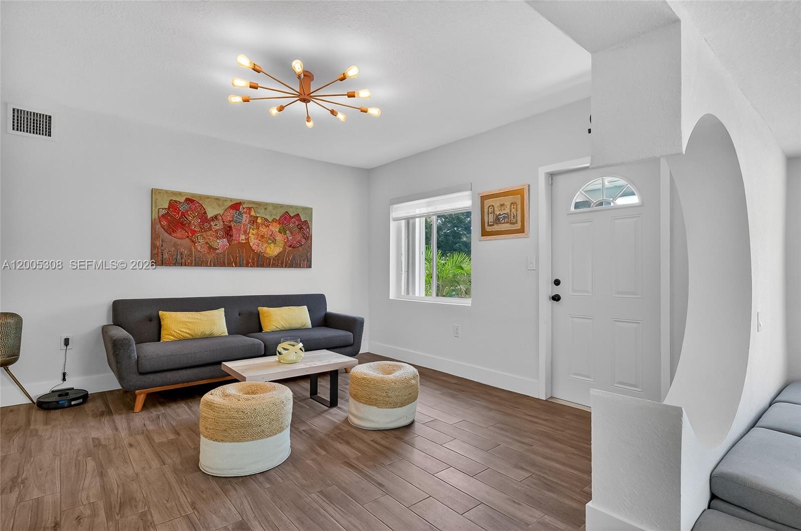 A brightly lit playroom features built-in storage cubbies, colorful toy bins, and a patterned rug — 541 NW 109th St, Miami FL 33168, MIAMI, FL