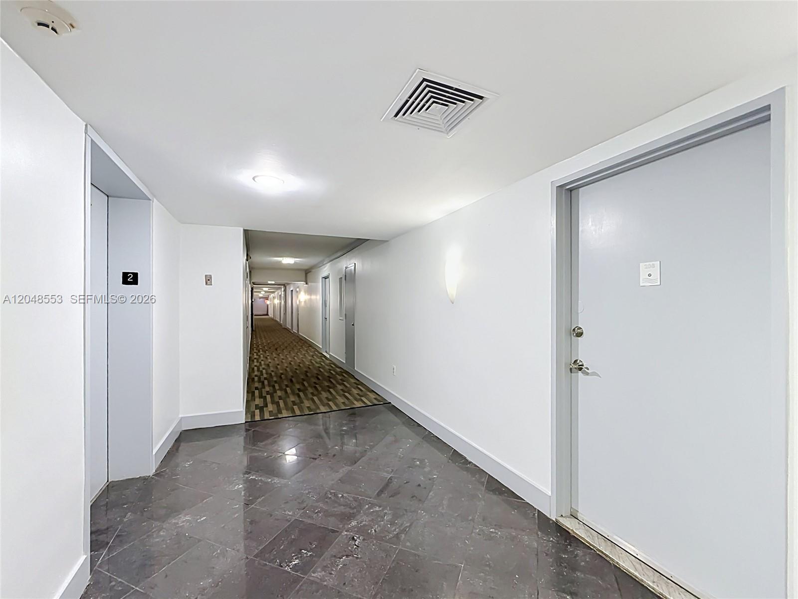 A hallway features a tiled floor, a carpeted corridor, and a door labeled 208 — 1228 West Ave # 208, Miami Beach FL 33139, MIAMI BEACH, FL