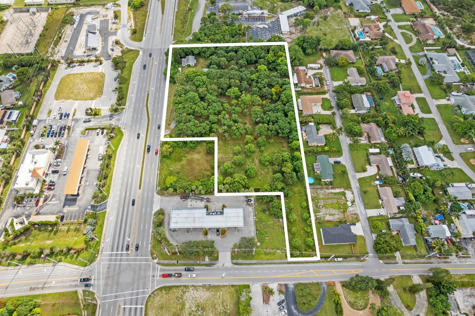 An aerial view shows a large, irregularly shaped plot of land outlined in white — 1908 Hypoluxo Road, Lake Worth FL 33462, LAKE WORTH, FL