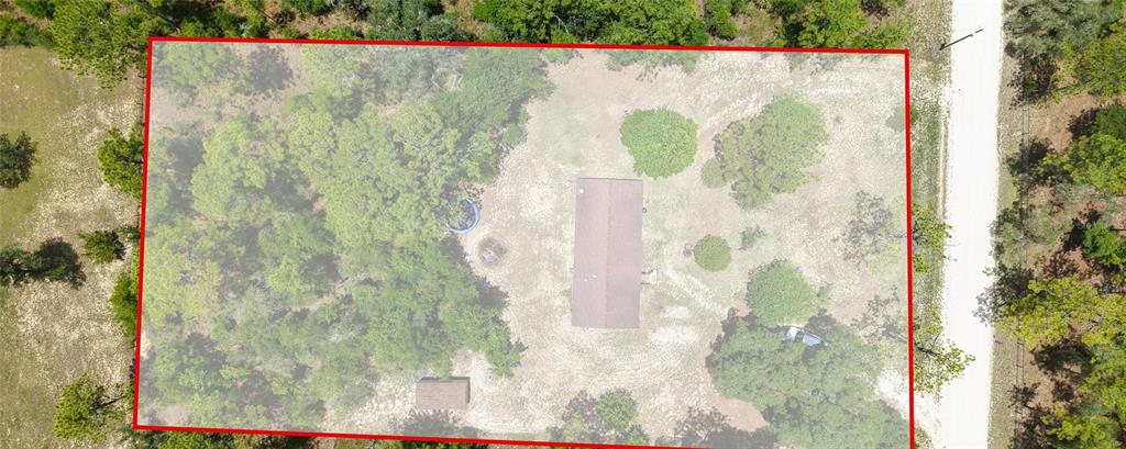 An aerial view shows a rectangular house and a small shed on a wooded lot — 14050 SE 20 STREET, MORRISTON, FL