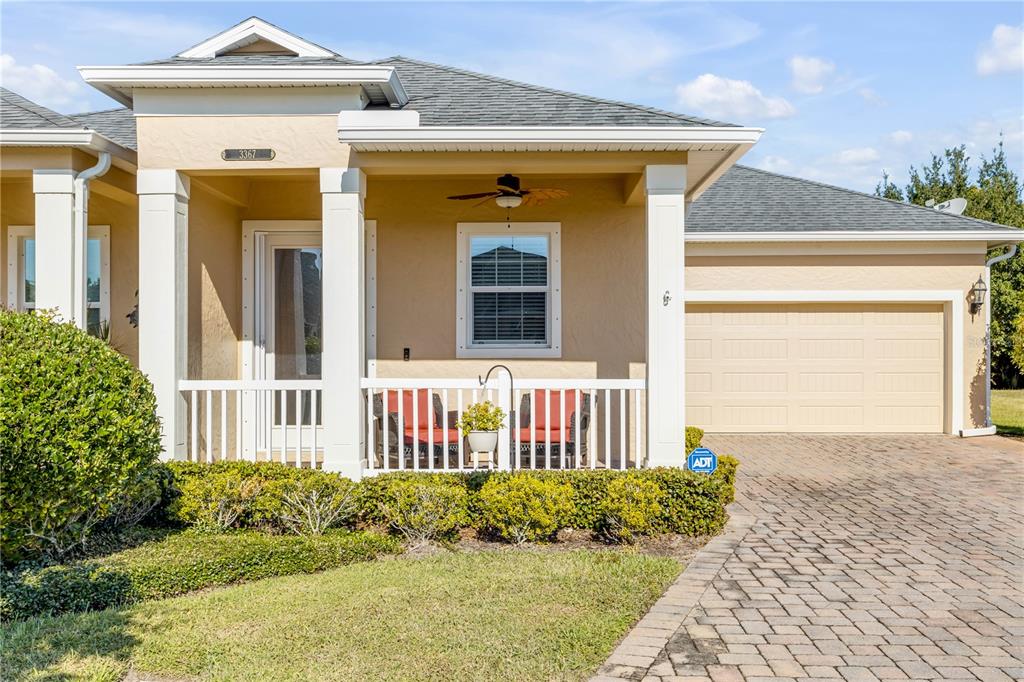 An aerial view shows a suburban neighborhood with houses, a curved street, and a pond — 3367 TORRE BOULEVARD, NEW SMYRNA BEACH, FL