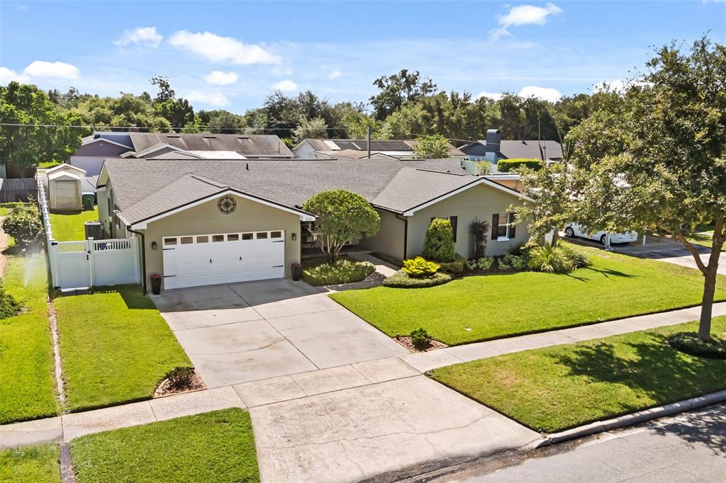 An aerial view of a single-story house with a two-car garage and green lawn — 616 BRECHIN DRIVE, WINTER PARK, FL