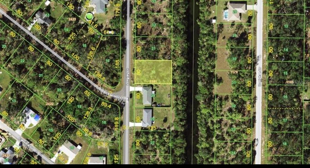 This is an aerial map showing a vacant rectangular lot highlighted in yellow along a road — 242 LONGLEY DRIVE, PORT CHARLOTTE, FL