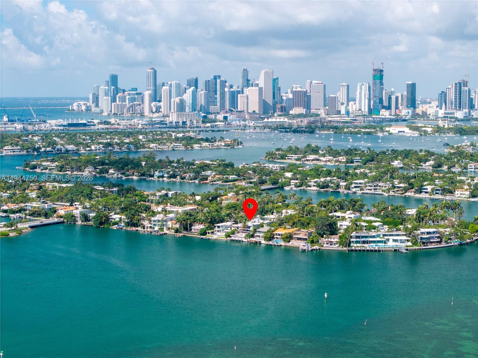 An aerial view of a waterfront residential island with a red pin marking a property — 333 E Rivo Alto Dr, Miami Beach FL 33139, MIAMI BEACH, FL
