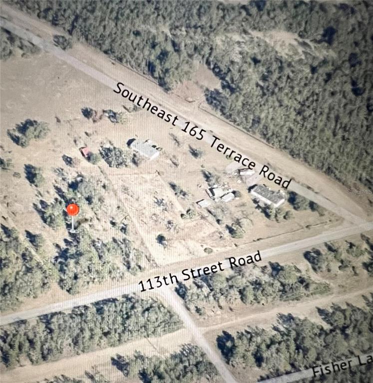 This is an aerial map view showing a plot of land at a road intersection — TBD SE 113TH STREET ROAD, OCKLAWAHA, FL