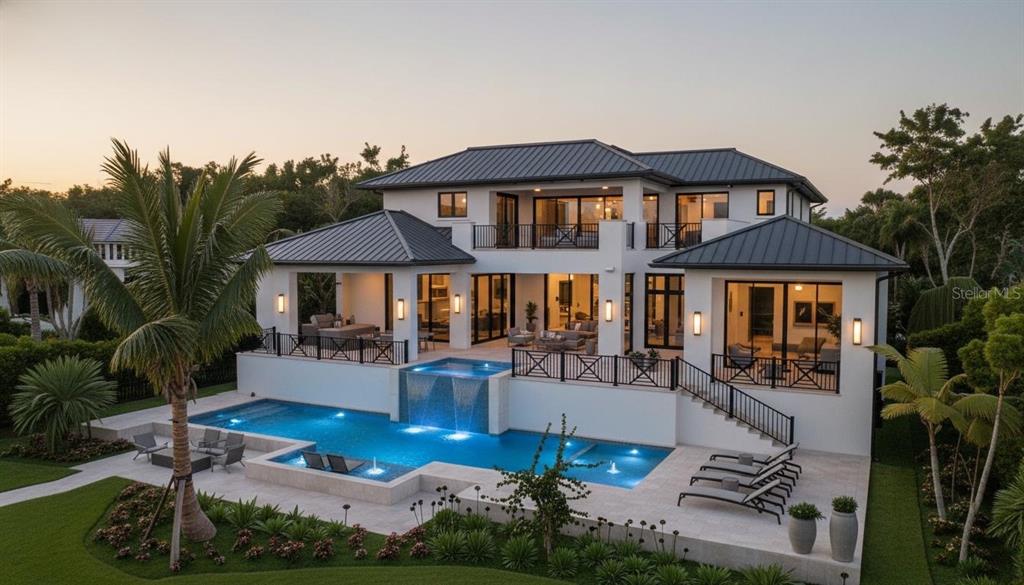 A two-story modern house with a metal roof, swimming pool, and elevated stone patio — 1290 HIDDEN HARBOR WAY, SARASOTA, FL