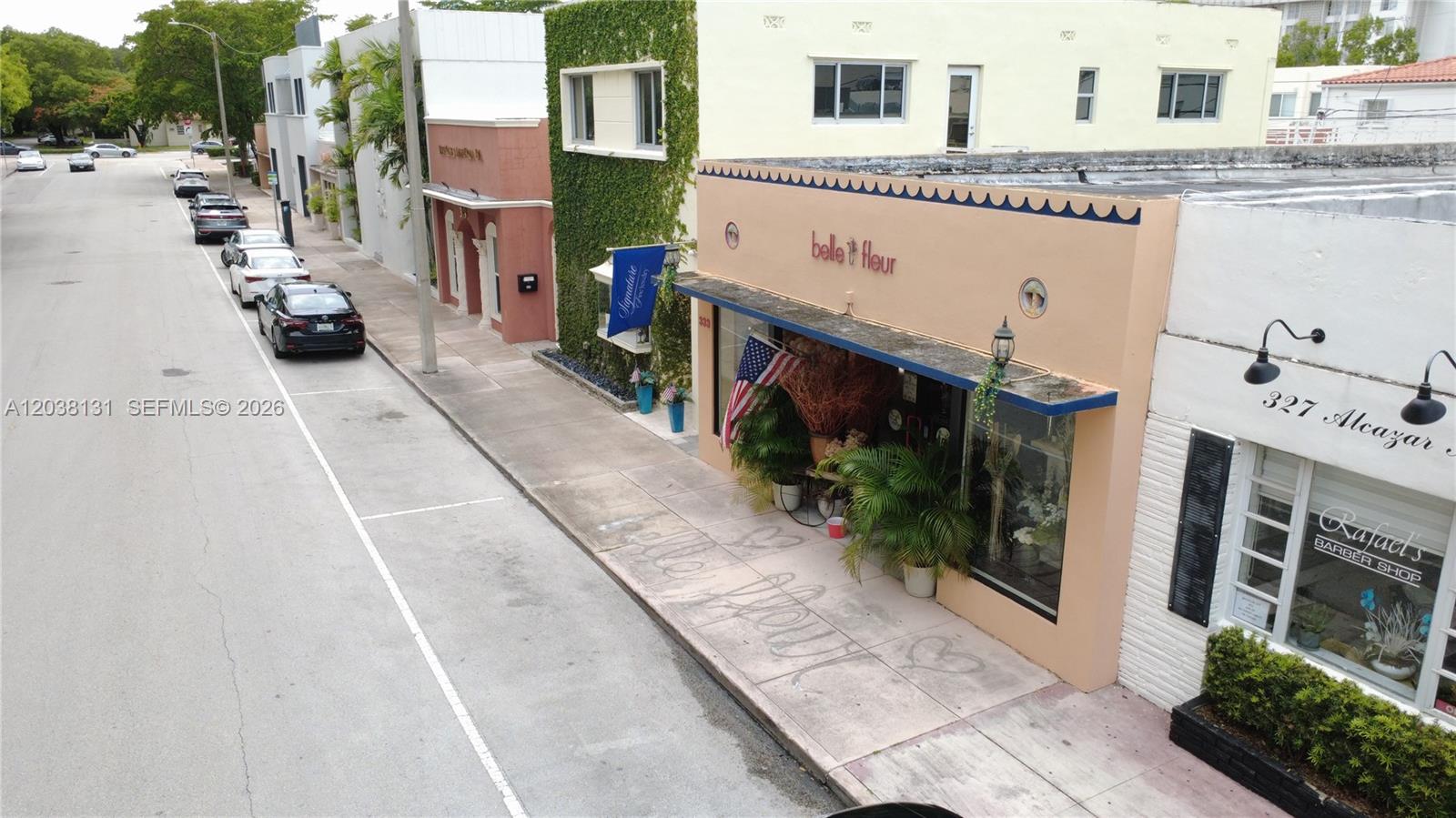 An aerial view shows a street with parked cars and storefronts, including a flower shop — 333 Alcazar Ave, Coral Gables FL 33134, CORAL GABLES, FL