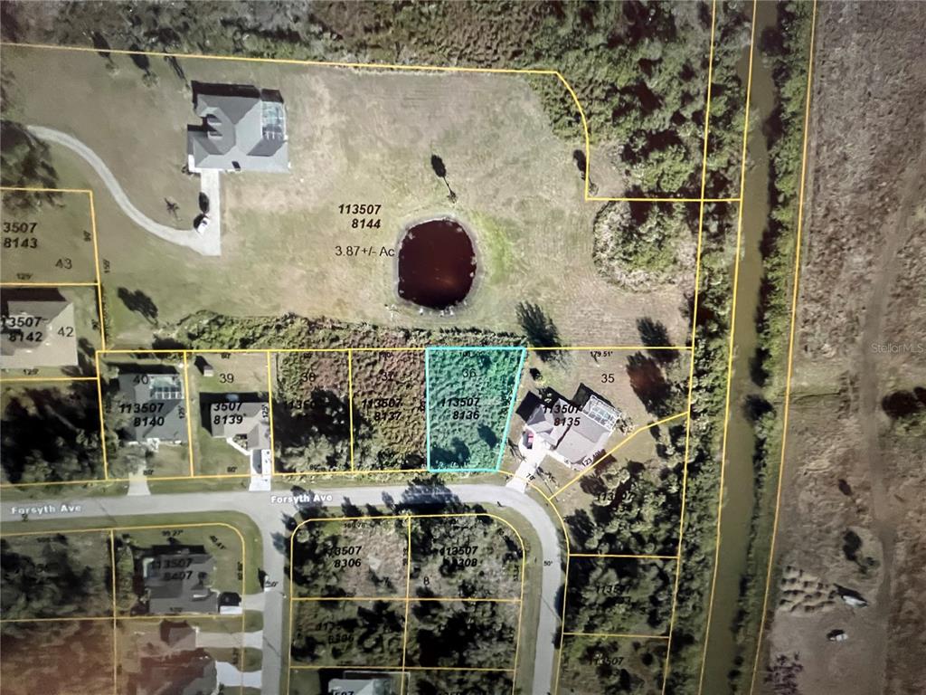 This is an aerial map showing a residential lot highlighted in blue among neighboring properties — LOT 36 FORSYTH AVENUE, NORTH PORT, FL