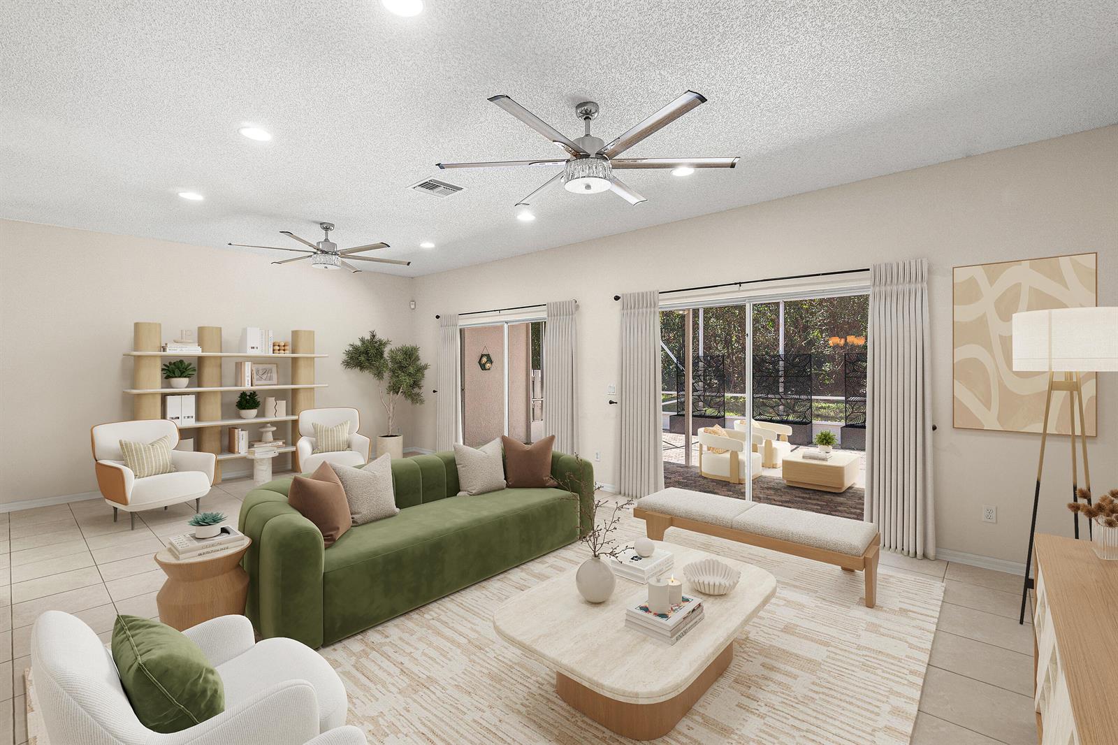This is a digitally staged living room featuring a green sofa, ceiling fans, and sliding doors — 10817 Fillmore Drive, Boynton Beach FL 33437, BOYNTON BEACH, FL