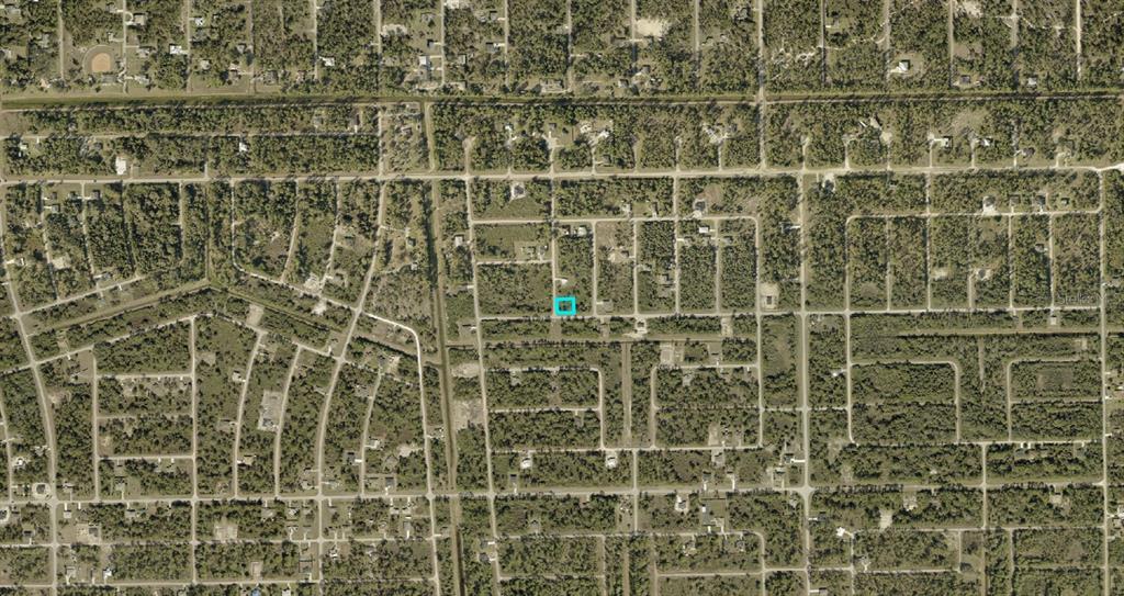 An aerial map view shows a highlighted rectangular plot of land within a residential neighborhood — 137 NACELLE AVENUE S, LEHIGH ACRES, FL
