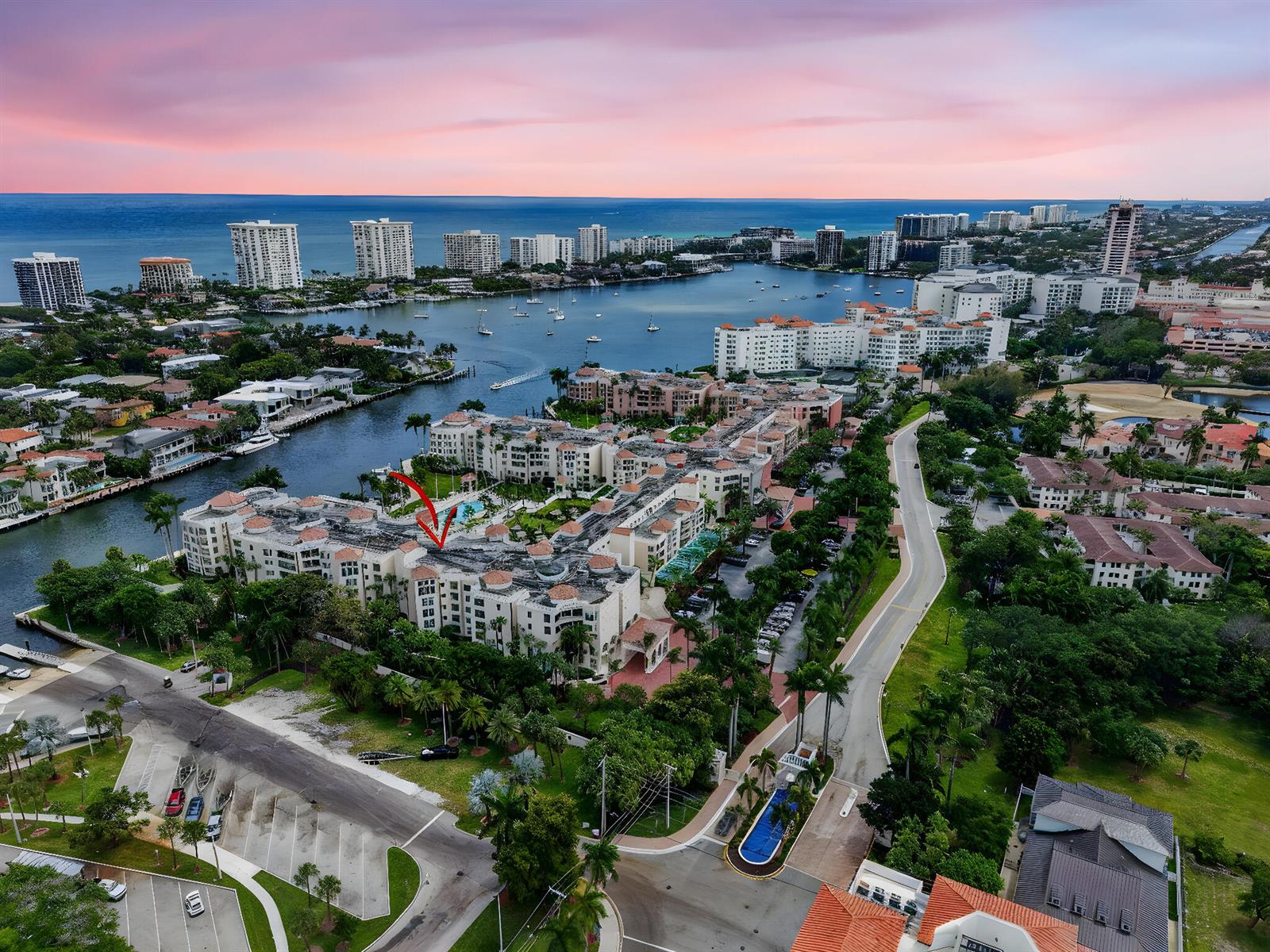 An aerial view shows a large residential complex with a red arrow pointing toward it — 100 SE 5th Avenue # 7, Boca Raton FL 33432, BOCA RATON, FL
