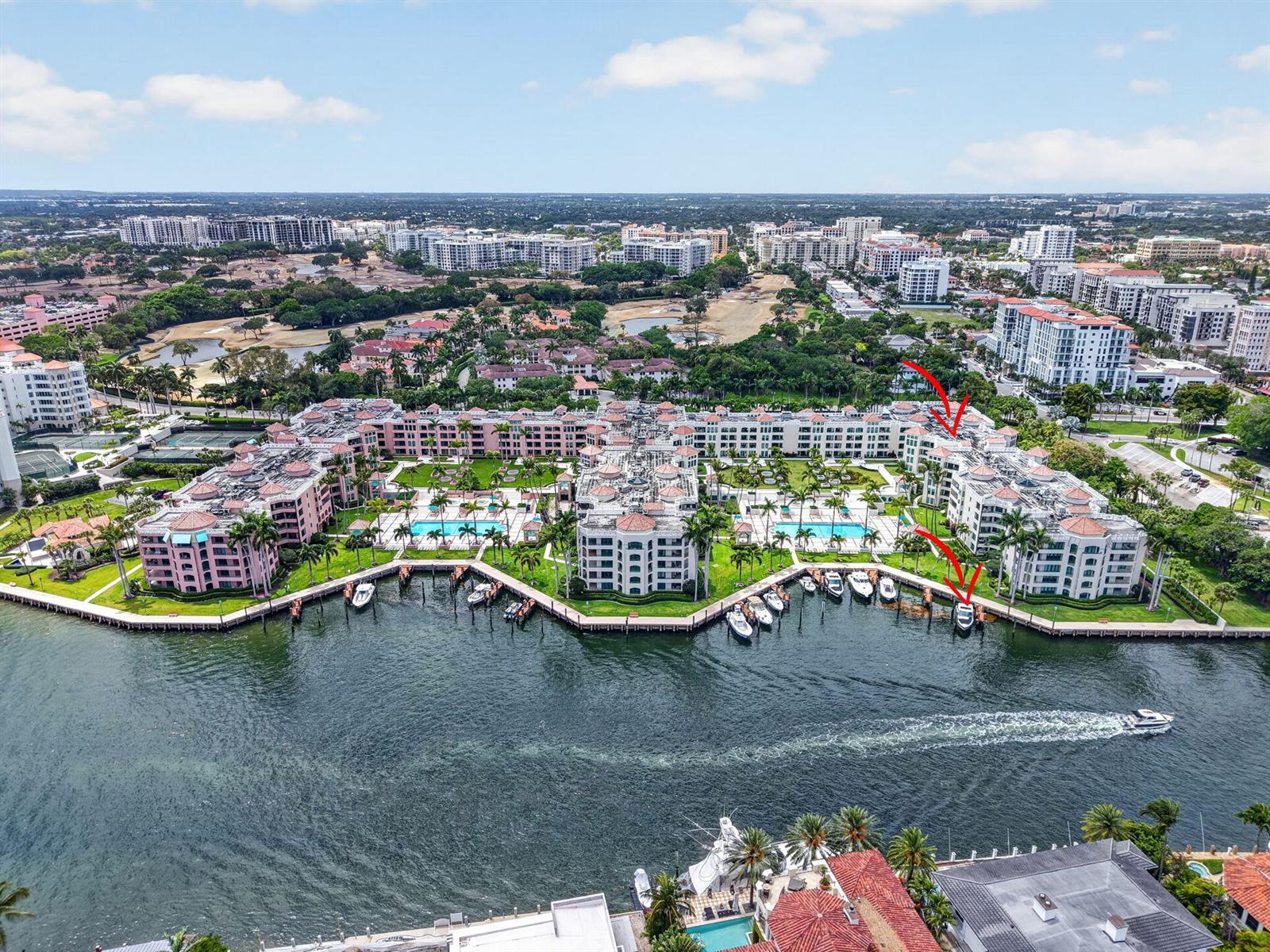 An aerial view of a waterfront residential complex with a pool and boat docks — 100 SE 5th Avenue # 7, Boca Raton FL 33432, BOCA RATON, FL