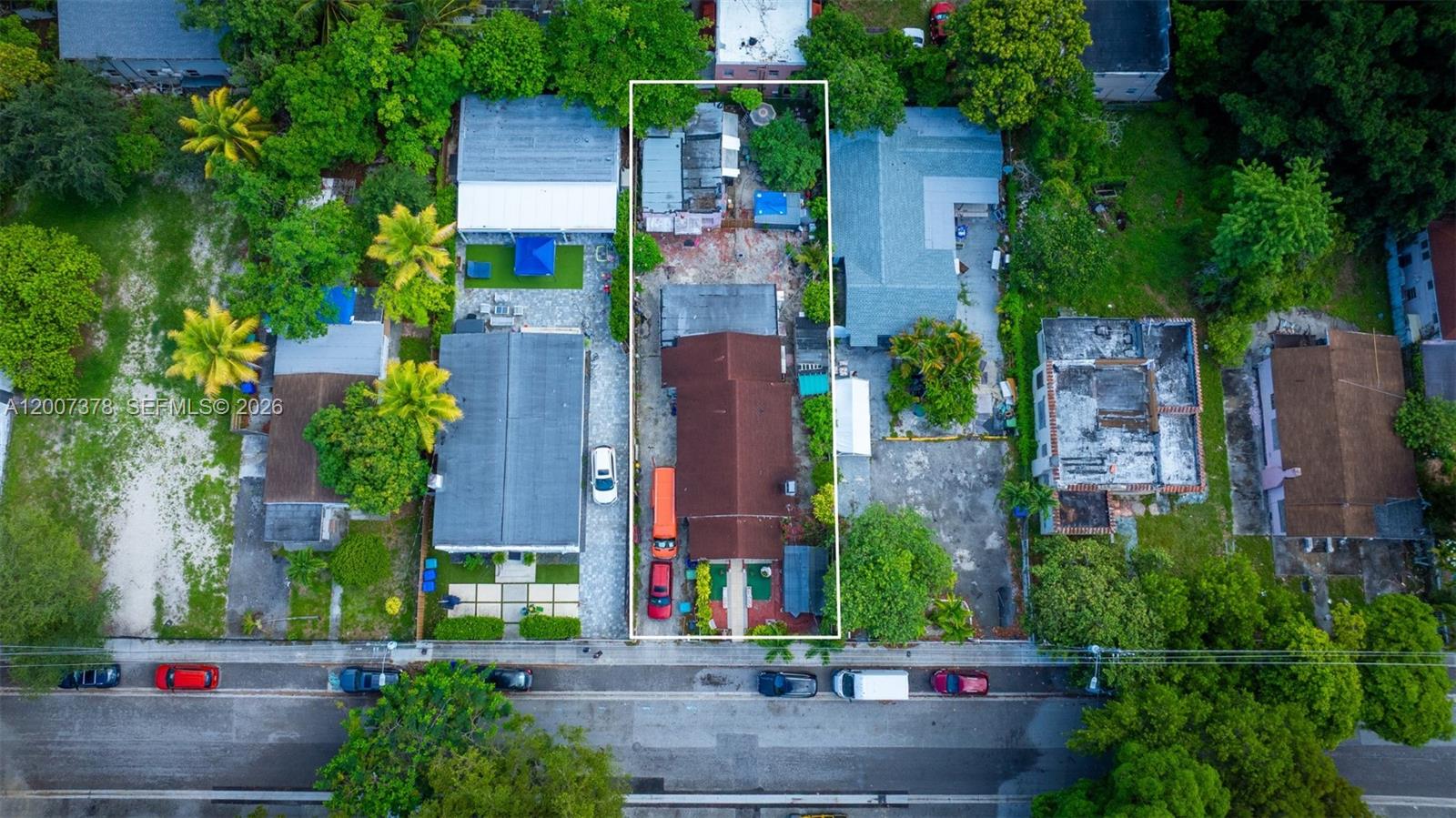 An aerial view shows a rectangular residential lot with a house, driveway, and backyard structures — 145 NW 31st St, Miami FL 33127, MIAMI, FL