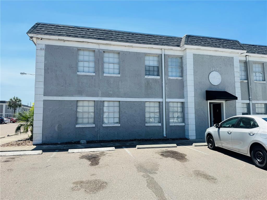 A two-story gray apartment building with white trim and a parking lot in front — 2777 L B MCLEOD ROAD UNIT 2777A, ORLANDO, FL