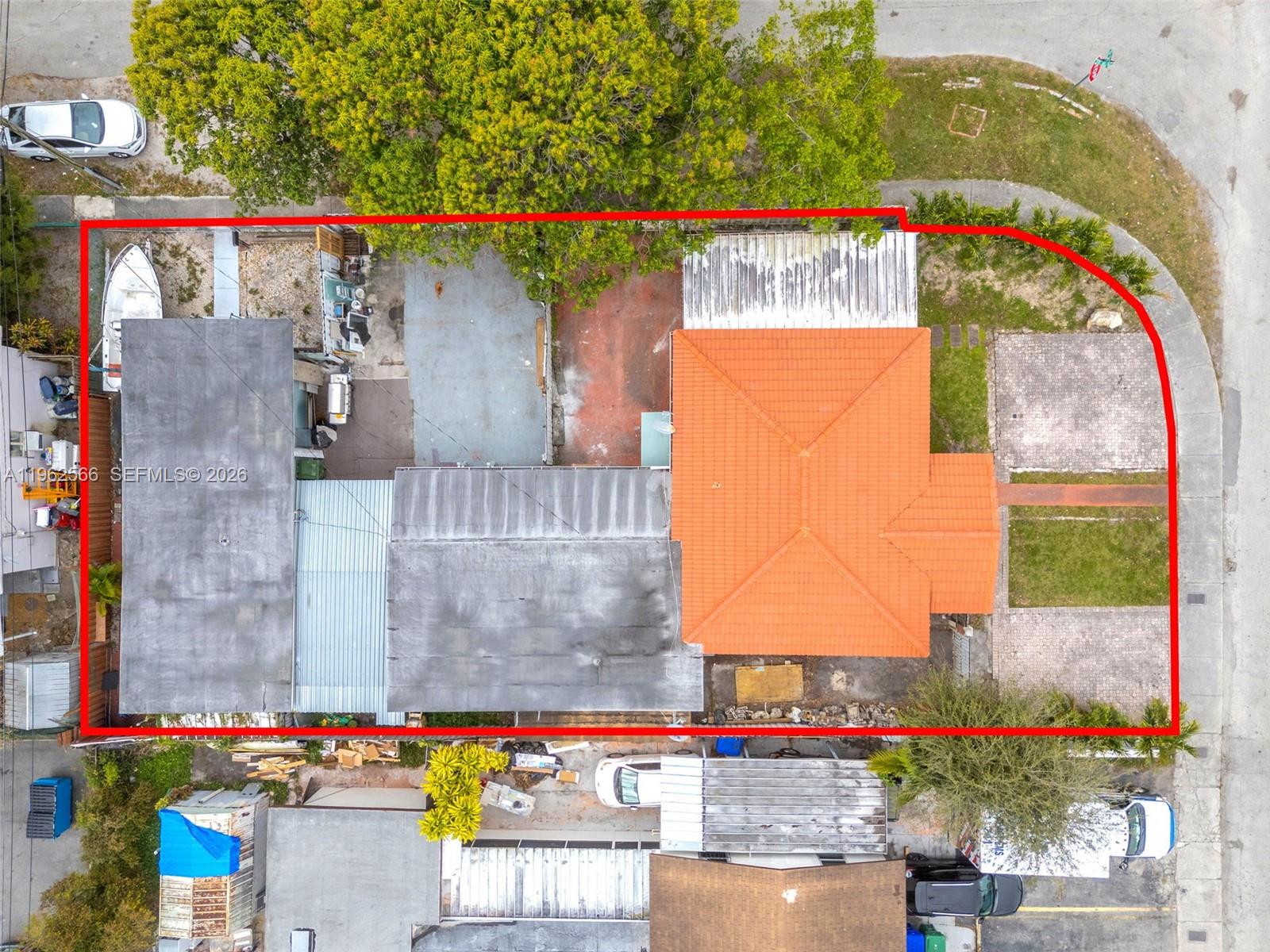 An aerial view shows a residential property with a red-tiled roof and fenced yard — 941 SW 31st Ct, Miami FL 33135, MIAMI, FL