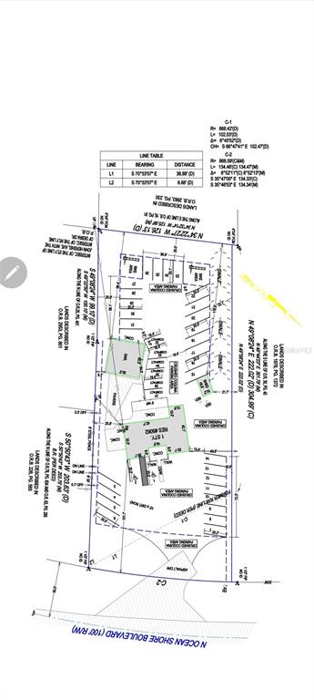 This is a land survey map showing property boundaries, building footprints, and parking spaces — 5062 N OCEAN SHORE BOULEVARD, PALM COAST, FL