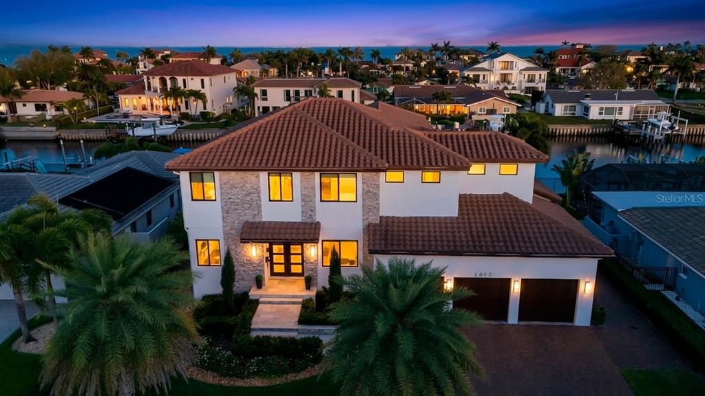 An aerial view of a two-story house with a tile roof and a two-car garage — 2060 ILLINOIS AVENUE NE, ST PETERSBURG, FL