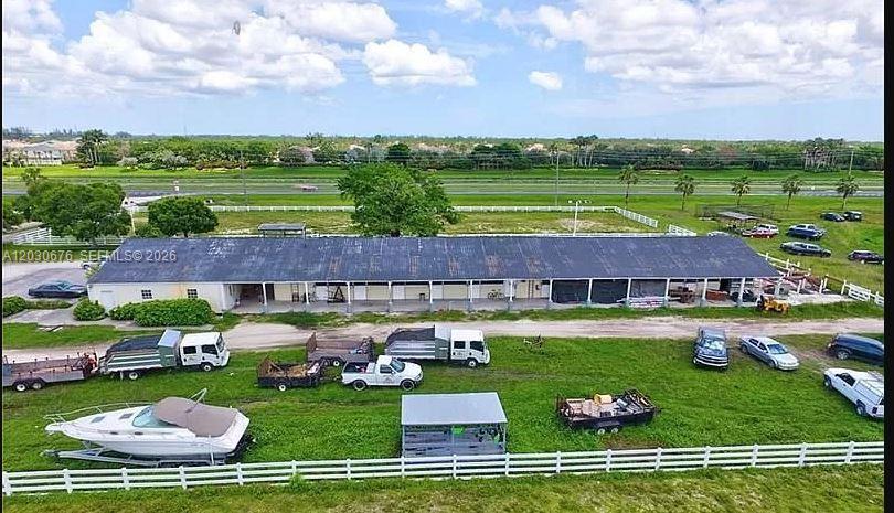An aerial view shows a long, single-story building with a dark roof and multiple stalls — 15621 S State Road 7, Delray Beach FL 33446, DELRAY BEACH, FL