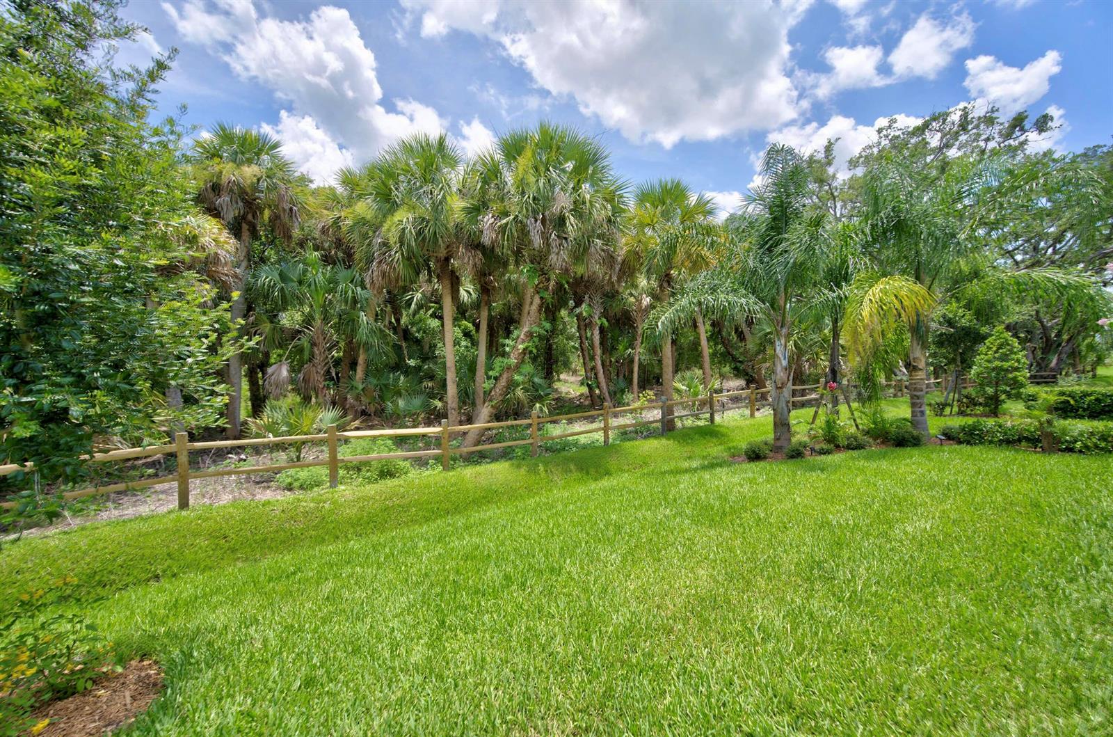 An aerial view shows a community clubhouse with a swimming pool and pickleball courts — 3862 White Alder Way, Vero Beach FL 32967, VERO BEACH, FL