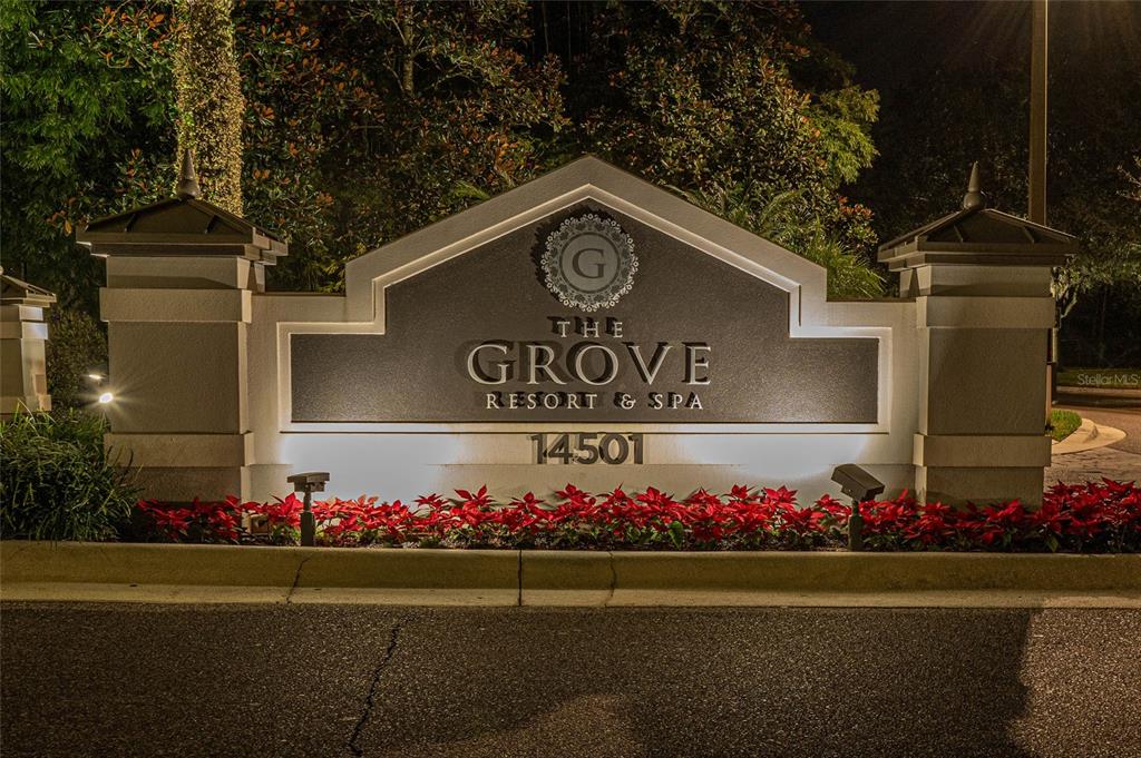 An illuminated monument sign for The Grove Resort & Spa stands at night — 14501 GROVE RESORT AVENUE UNIT 2534, WINTER GARDEN, FL