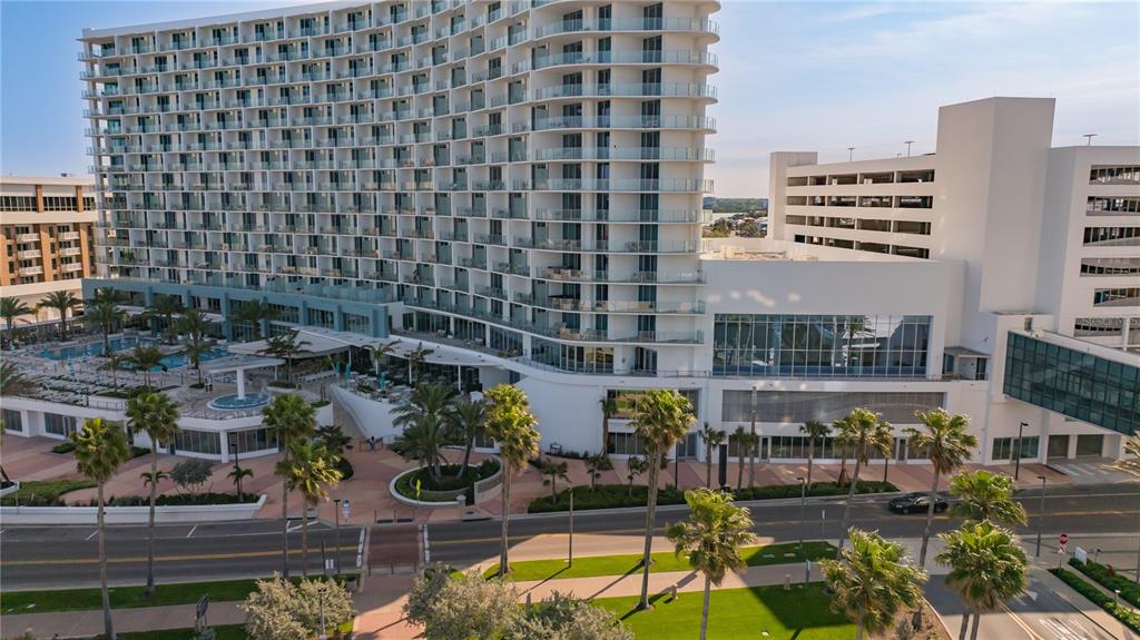An aerial view of a large, modern hotel with a pool deck and parking garage — 400 CORONADO DRIVE, CLEARWATER BEACH, FL