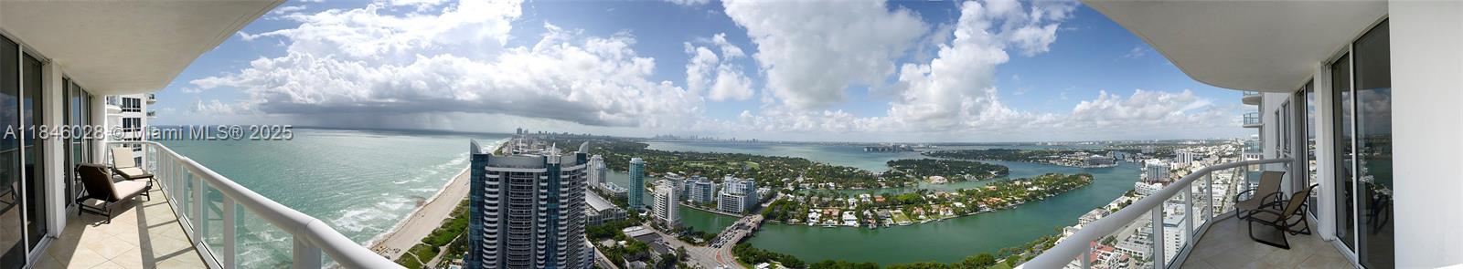 A panoramic view from a high-rise balcony overlooking the ocean, coastline, and city waterways — 6365 Collins Ave # 3907, Miami Beach FL 33141, MIAMI BEACH, FL