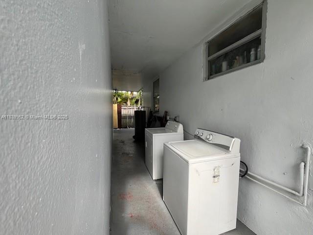 A narrow outdoor laundry area features a white washing machine and dryer against a wall — 7230 NW 3rd St, Miami FL 33126, MIAMI, FL