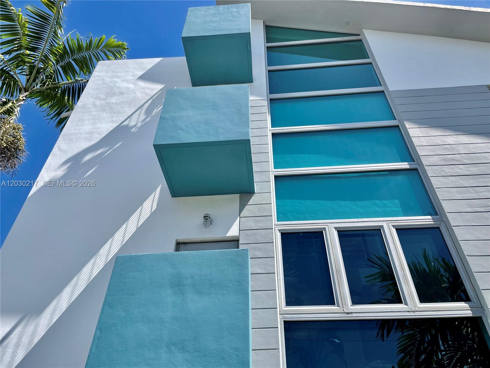 An aerial view of a dense urban neighborhood near the coast with a location pin — 734 Michigan Ave, Miami Beach FL 33139, MIAMI BEACH, FL