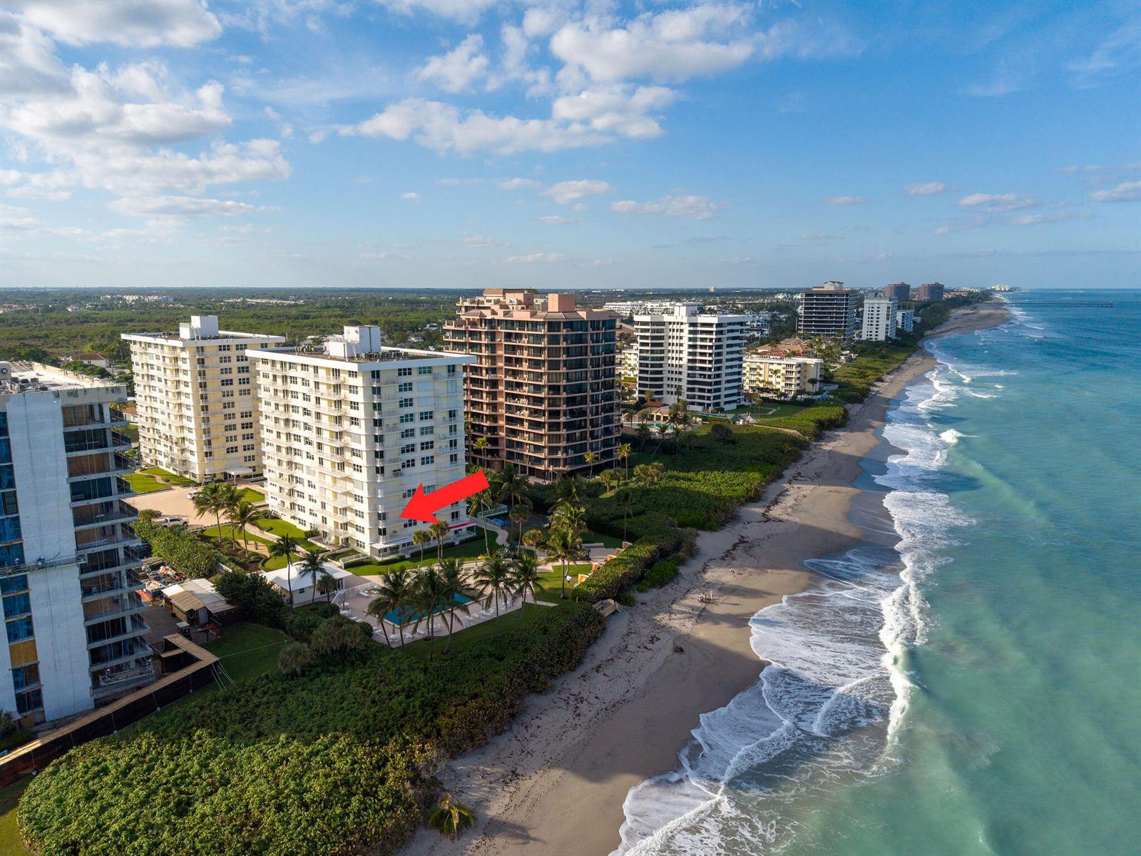 An aerial view shows several high-rise apartment buildings located directly along a sandy beach — 500 Ocean Drive # 2d, Juno Beach FL 33408, JUNO BEACH, FL