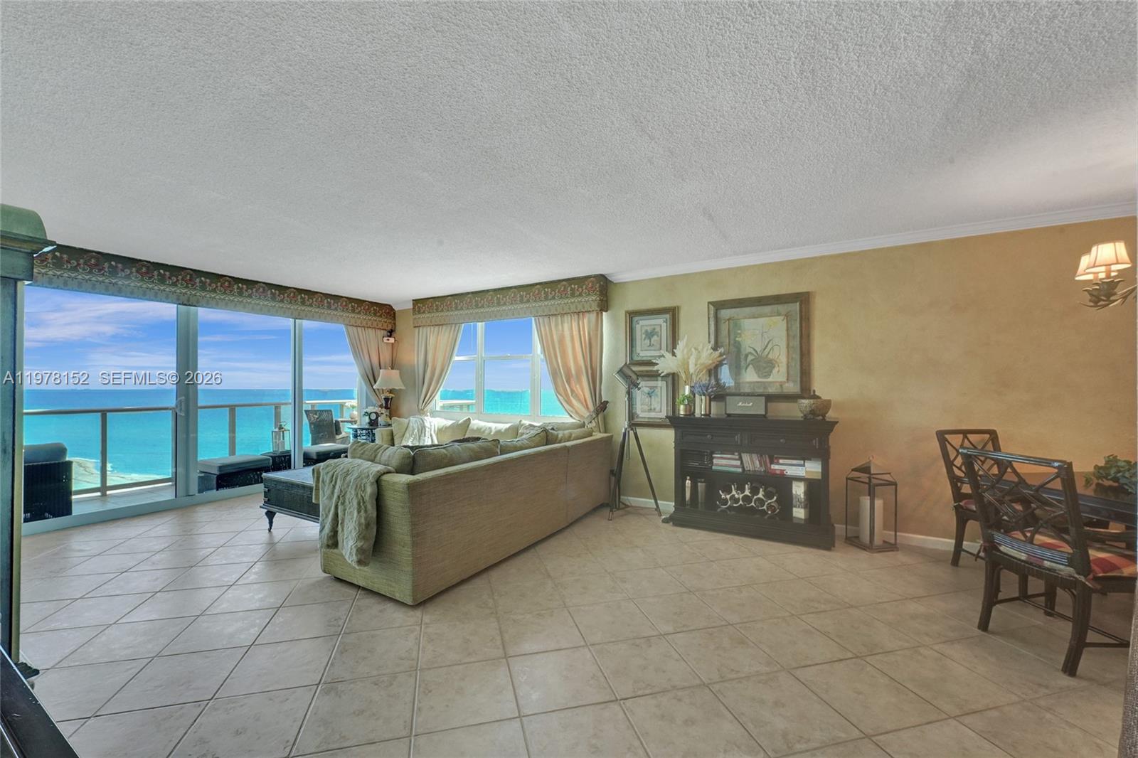 A living room with tile floors features a large sectional sofa and ocean views — 2501 S Ocean Dr # 1510, Hollywood FL 33019, HOLLYWOOD, FL