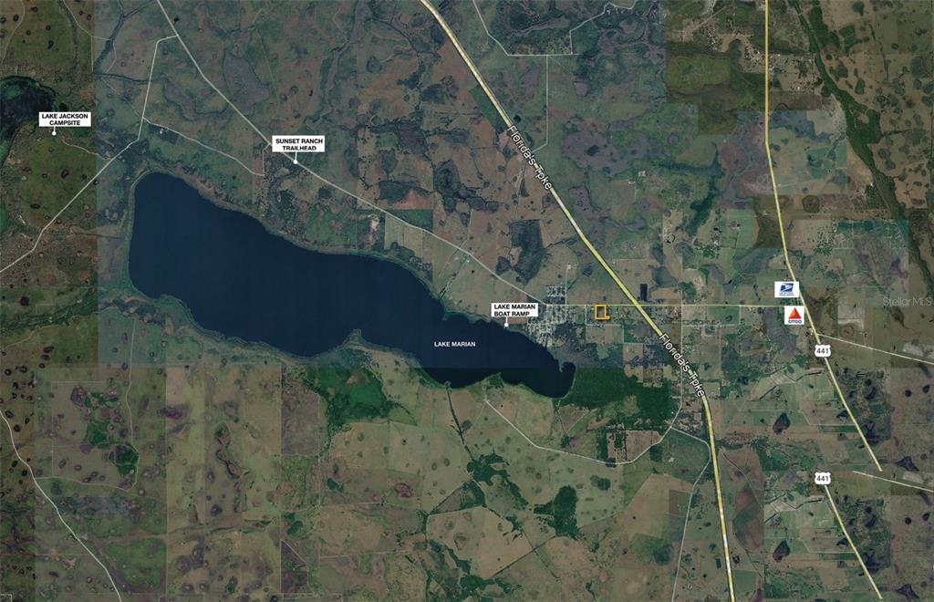 This is an aerial map showing Lake Marian, surrounding land, and nearby roadways — 350 S CANOE CREEK ROAD, KENANSVILLE, FL