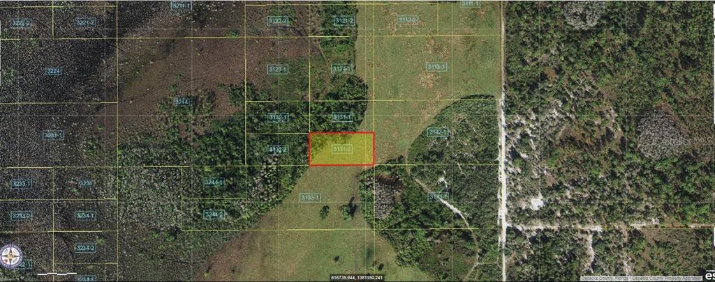 This is an aerial map showing a highlighted rectangular parcel of land among surrounding lots — HOLOPAW GROVES ROAD, ST CLOUD, FL