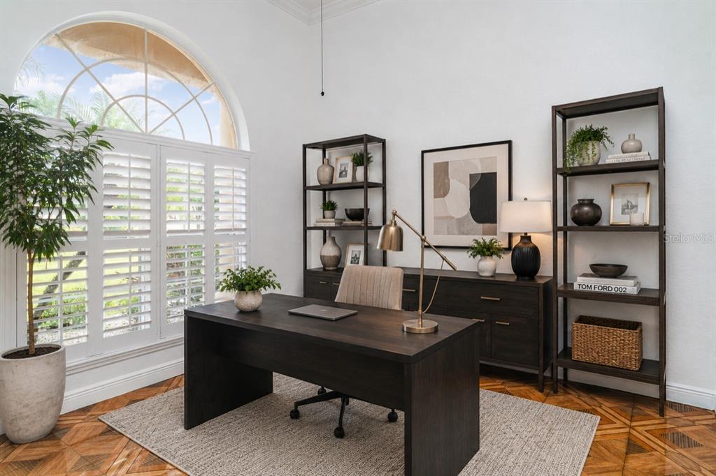 A bright, open-concept living room features tile flooring, a sectional sofa, and a dining area — 6120 9TH AVENUE CIRCLE NE, BRADENTON, FL