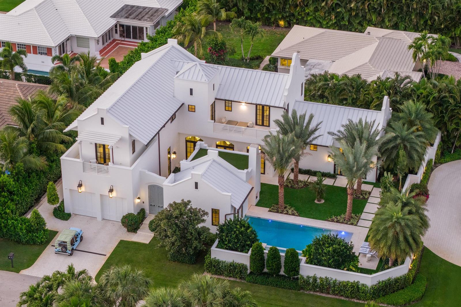 An aerial view of a white two-story house with a metal roof and swimming pool — 734 S Ocean Boulevard, Delray Beach FL 33483, DELRAY BEACH, FL