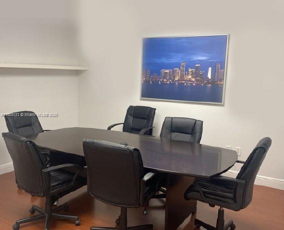 A conference room features a dark wood table, five black chairs, and a city skyline print — 3500 NW 114th Ave # 212, Doral FL 33178, DORAL, FL