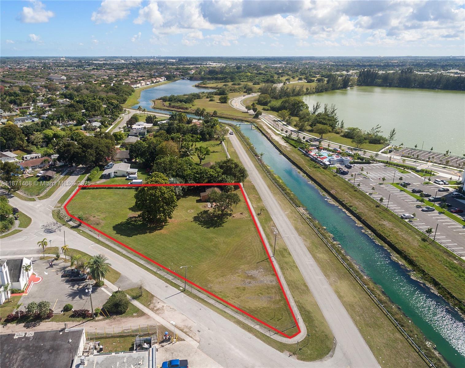 An aerial view shows a triangular plot of land outlined in red next to a canal — 272 Street, Naranja FL 33032, NARANJA, FL