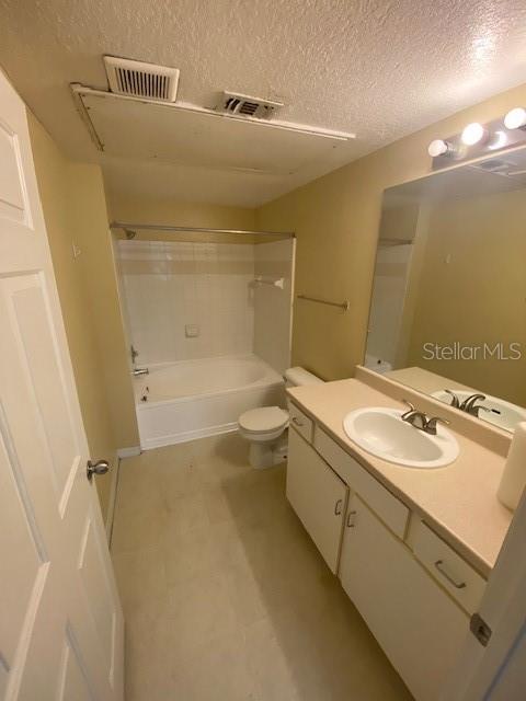 A bathroom features a white vanity, a toilet, and a shower-tub combination with white tile — 2010 E PALM AVENUE UNIT 15208, TAMPA, FL