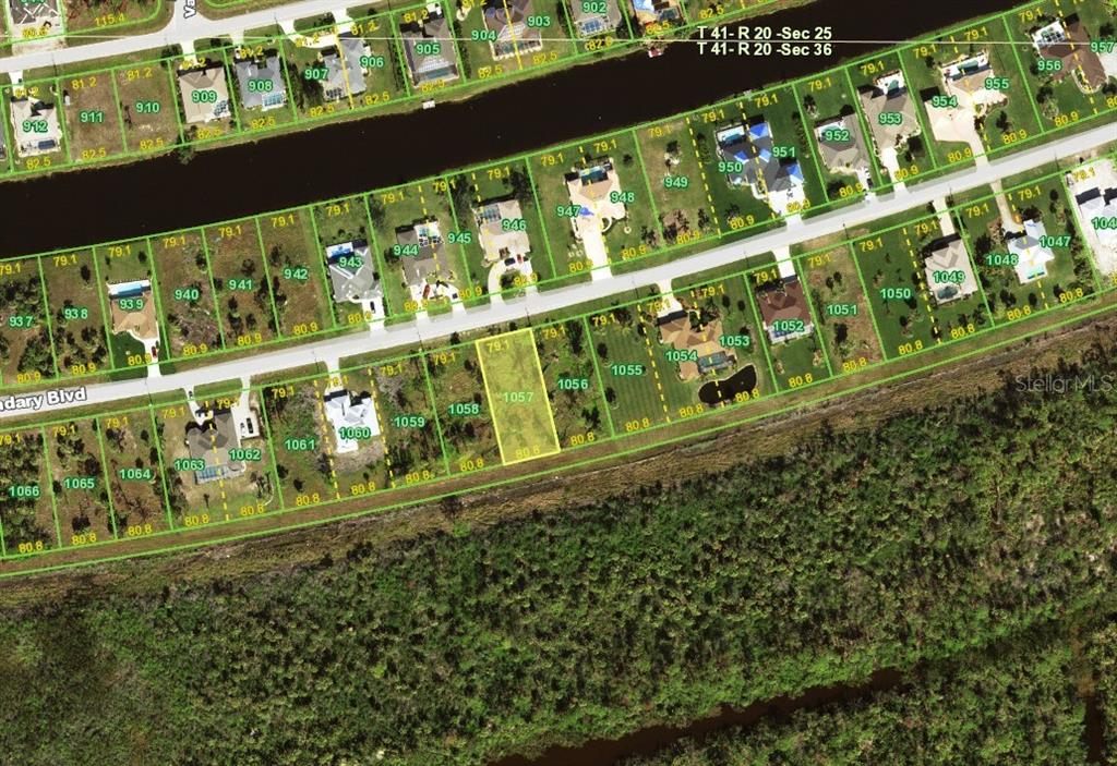 This is an aerial map showing residential lots along a canal and a road — 1153 BOUNDARY BOULEVARD, ROTONDA WEST, FL