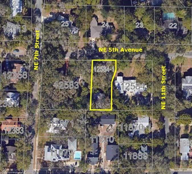 This is an aerial map showing a highlighted residential lot surrounded by neighboring properties and streets — 725 NE 5TH AVENUE, GAINESVILLE, FL