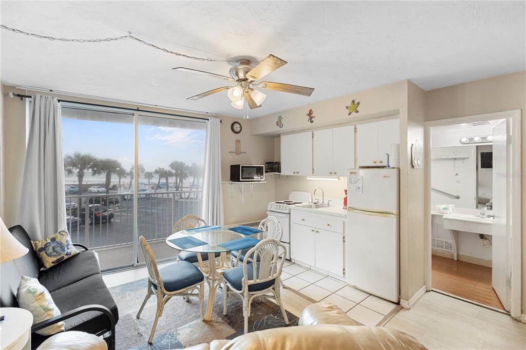 An elevated view from a balcony overlooking a parking lot and the ocean beach — 1233 S ATLANTIC AVENUE UNIT 2270, DAYTONA BEACH, FL