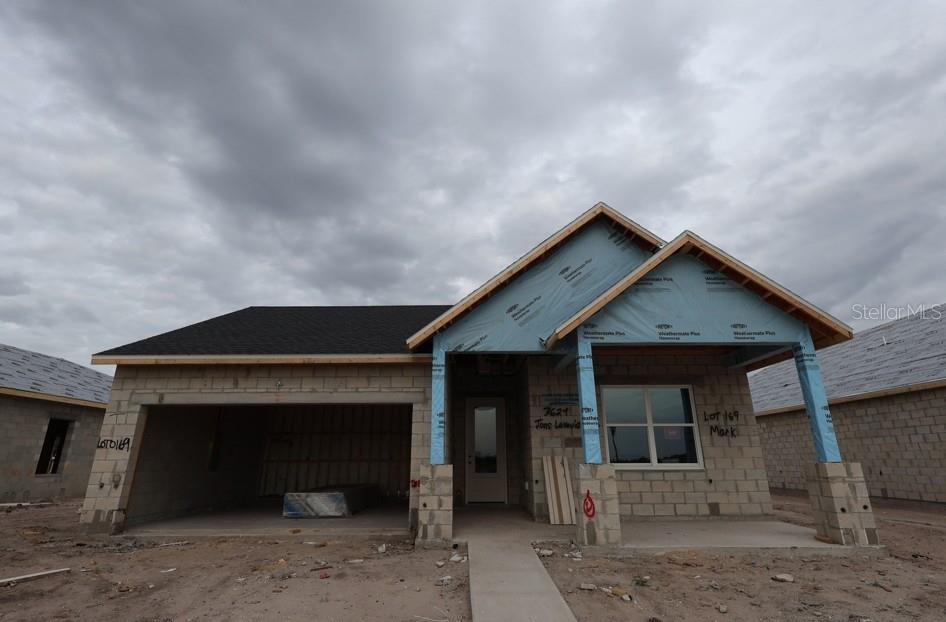 A single-story house under construction with concrete block walls and a shingled roof — 3624 JONS LAKEVIEW STREET, PLANT CITY, FL
