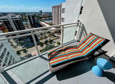 A beach view featuring an orange and white umbrella, sand, ocean, and a blue sky — 2030 S Ocean Dr # 1802, Hallandale Beach FL 33009, HALLANDALE BEACH, FL